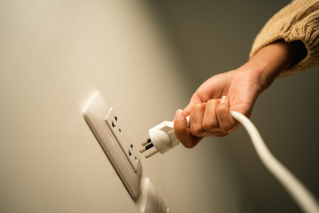 plugging power strip into wall